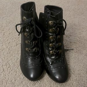 Black wedge heeled lace up booties. Moto boots